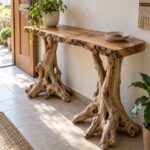 Natural wood console table with organic root legs and a live edge top.