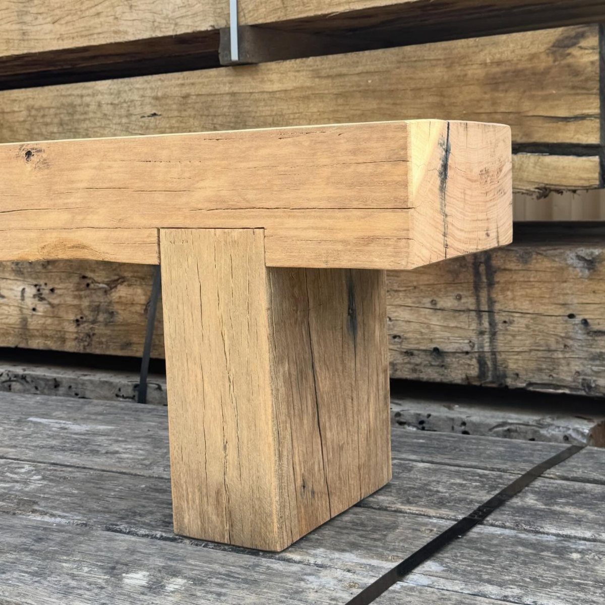 Wooden timber frame joint showing the shoulder of a beam resting on a post.